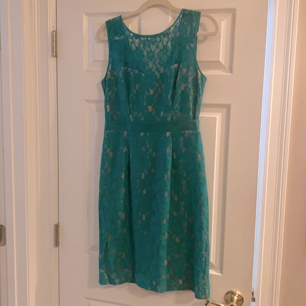 Size 8 BCBG lace green dress with tan under lay.